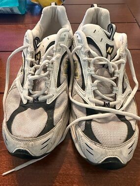 New Balance White, Black and Gold Athletic Sneakers